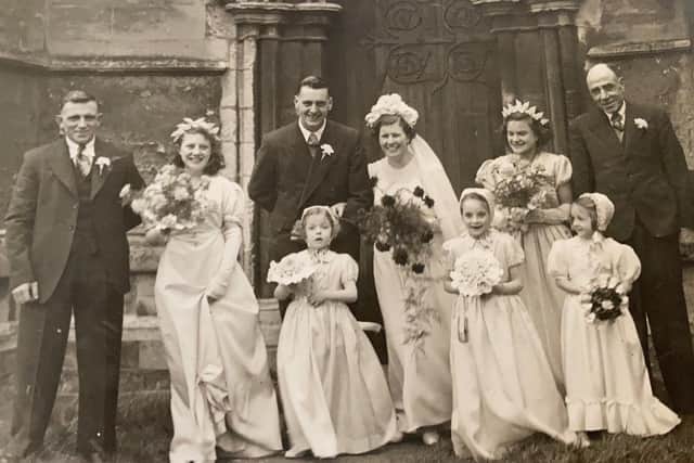 Bob and Brenda Gathercole on their wedding day with relatives in March 1952 EMN-220404-171134001