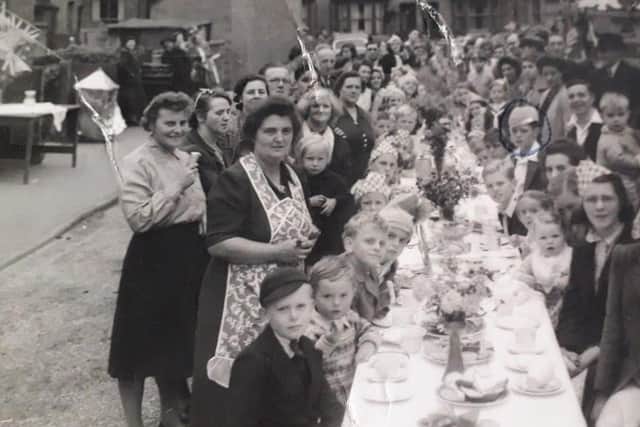 Residents who lived in houses off Burton Road, Melton, pictured during a street party to celebrate VE Day iin May 1945 EMN-220504-133744001