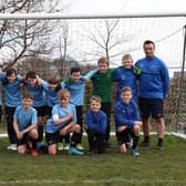 Pictured are Asfordby Cobras who faced Glenfield United in the final of the under 11s county cup final on Sunday. Coaches Leon Elford and Wayne Pymm are also pictured.