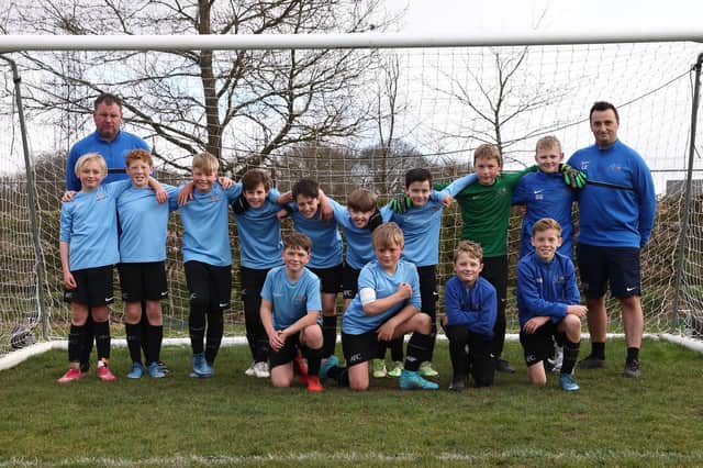 Pictured are Asfordby Cobras who faced Glenfield United in the final of the under 11s county cup final on Sunday. Coaches Leon Elford and Wayne Pymm are also pictured.