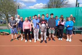 Pictured are Leon, Thomas and Toby with club members.