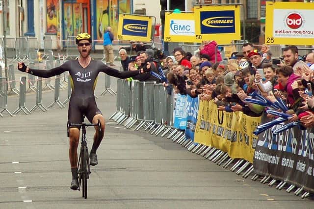 Conor Dunne milks the applause as he crosses the line in Sherrard Street for the biggest win of his career in the CiCLE Classic in 2016 EMN-220420-092047001