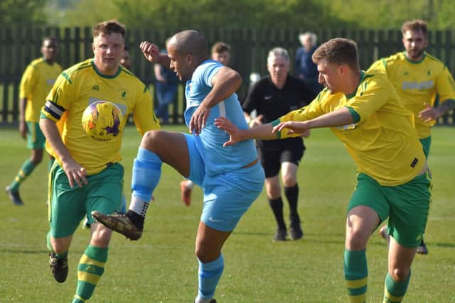 The Sports skipper battling for possession. Photo: Tim Williams