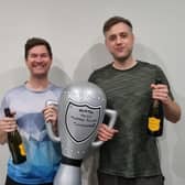 Celebrating with the trophy.