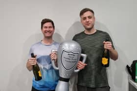 Celebrating with the trophy.