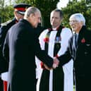 The Duke of Edinburgh greets Dr Sandy Saunders at the unveiling ceremony for a new memorial to the iconic Guinea Pig Club at the National Memorial Arboretum in 2016, watched by Maggie Saunders (right) EMN-210904-170816001