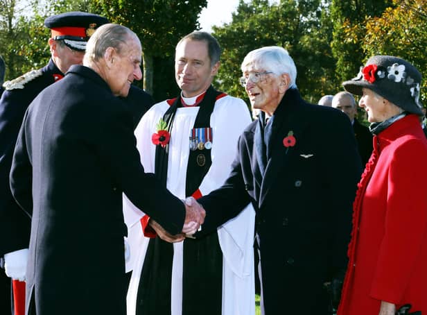 The Duke of Edinburgh greets Dr Sandy Saunders at the unveiling ceremony for a new memorial to the iconic Guinea Pig Club at the National Memorial Arboretum in 2016, watched by Maggie Saunders (right) EMN-210904-170816001