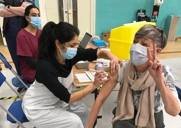 Latham House GP Dr Fahreen Dhanji gives a coronavirus jab to a patient at the vaccination centre at Melton Sports Village EMN-210421-112122001