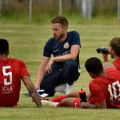 Tom Manship talks to his Melton Town players during a match - they may soon be playing on an advanced 3G football pitch if planning permission is given EMN-210428-140930001