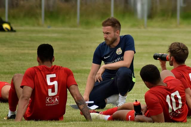 Tom Manship talks to his Melton Town players during a match - they may soon be playing on an advanced 3G football pitch if planning permission is given EMN-210428-140930001