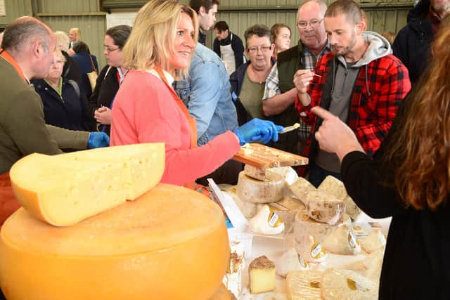 Visitors taste cheese at the 2017 Artisan Cheese Fair in Melton EMN-210427-172530001