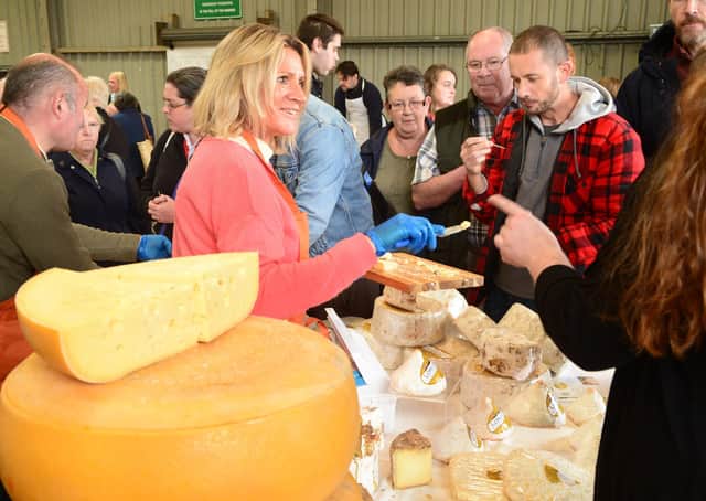 Visitors taste cheese at the 2017 Artisan Cheese Fair in Melton EMN-210427-172530001