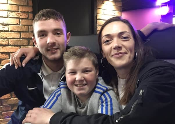 Kristie Bishop with family members EMN-210428-114055001