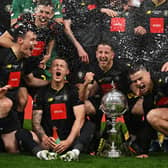 Thomson, right, celebrates with teammates. Photo: Getty Images