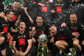 Thomson, right, celebrates with teammates. Photo: Getty Images
