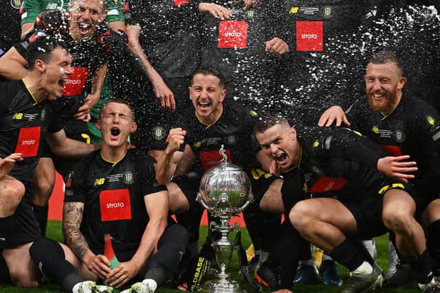 Thomson, right, celebrates with teammates. Photo: Getty Images