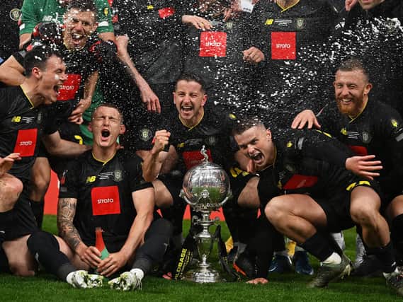 Thomson, right, celebrates with teammates. Photo: Getty Images