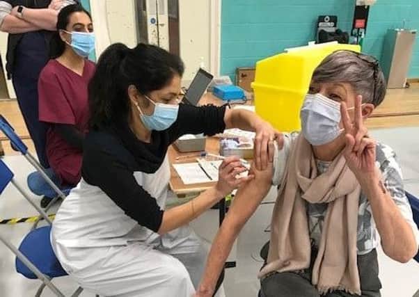 Latham House GP Dr Fahreen Dhanji gives a coronavirus jab to a patient at the vaccination centre at Melton Sports Village EMN-210705-172501001