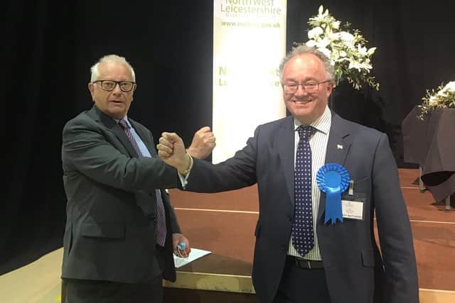 New Leicestershire and Rutland Police and Crime Commissioner (PCC), Rupert Matthews (Conservative Party), on the right, is congratulated on his election victory by outgoing PCC, Lord Willy Bach (Labour Party) EMN-211005-093143001