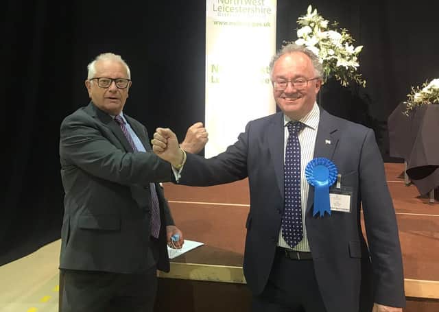 New Leicestershire and Rutland Police and Crime Commissioner (PCC), Rupert Matthews (Conservative Party), on the right, is congratulated on his election victory by outgoing PCC, Lord Willy Bach (Labour Party) EMN-211005-093143001