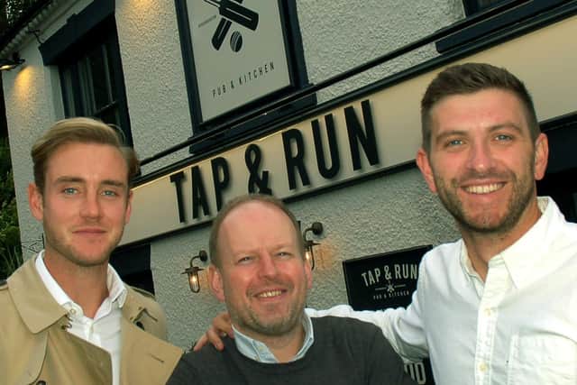 England cricketer Stuart Broad (left) with Notts CCC team-mate Harry Gurney (right) and director Dan Cramp outside their pub - the Tap and Run at Upper Broughton EMN-211205-162558001