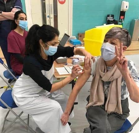 Latham House GP Dr Fahreen Dhanji gives a coronavirus jab to a patient at the vaccination centre at Melton Sports Village EMN-210514-141309001