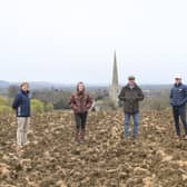 Scott O'Dell, of Fisher German, with Emily, James, George and Clair Goodson at the site of their planned natural burial ground at Bottesford EMN-210515-145341001