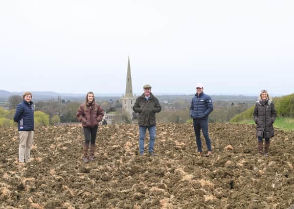 Scott O'Dell, of Fisher German, with Emily, James, George and Clair Goodson at the site of their planned natural burial ground at Bottesford EMN-210515-145341001