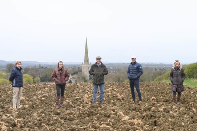 Scott O'Dell, of Fisher German, with Emily, James, George and Clair Goodson at the site of their planned natural burial ground at Bottesford EMN-210515-145341001