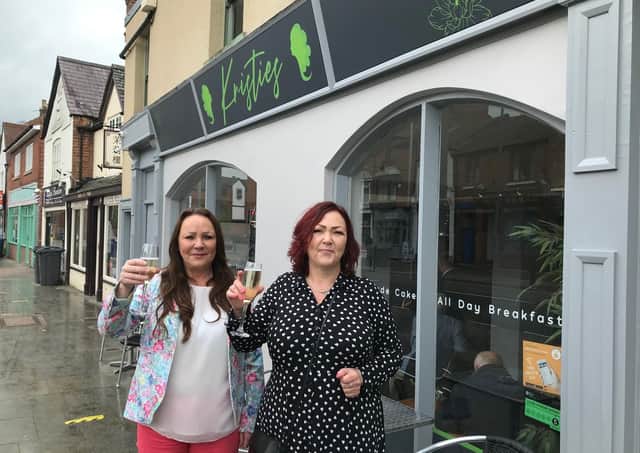 Jolli Waterland (left) outside her new Melton restaurant, Kristie's, with sister Dominique Carnall, mother of the late Kristie Bishop, whose memory inspired the eaterie EMN-210517-174629001