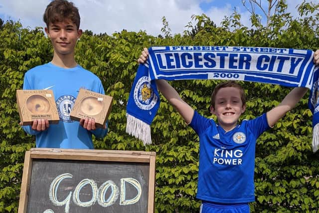 Customers at Asfordby Hill-based Brocklebys Pies got into the cup final spirit by snapping up special Moo and Blue pies prior to Saturday's match - pictured are Connor (left) and Tyler picking up their pies EMN-210517-153938001