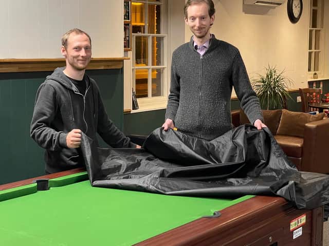 Covers off: Owner Ben Jackson (right) and staff member Karl Barratt preparing to reopen Jackson’s Lounge after lockdown restrictions were eased this week