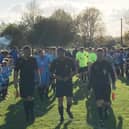 Youth players form a guard of honour at Asfordby FC as the teams take the field for last night's emotional testimonial match for Callum Payne EMN-210526-090538001