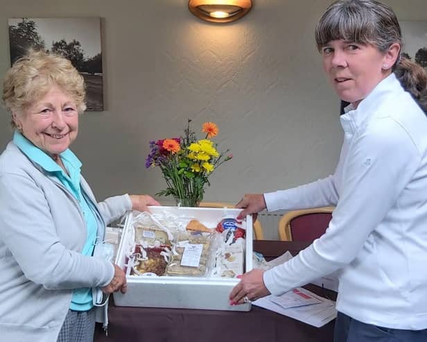 Sue Bennett collects her prize.