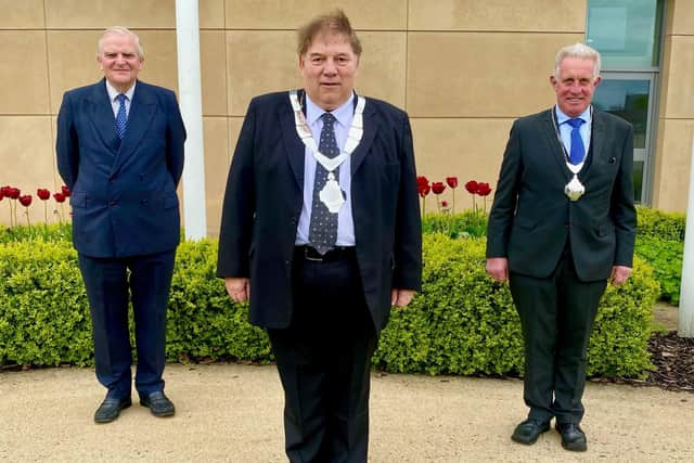 New Mayor of Melton, Councillor Peter Faulkner, flanked by outgoing Mayor, Councillor Malise Graham (left) and newly-elected Deputy Mayor, Councillor Alan Hewson EMN-210526-125500001