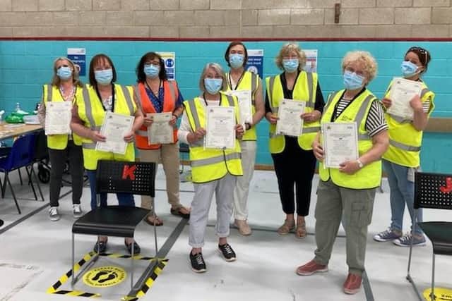 Some of the members of the team at the vaccination centre at Melton Sports Village holding 'thankyou' certificates, which were given to each team member by the local Primary Care Network EMN-210306-174525001