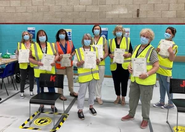 Some of the members of the team at the vaccination centre at Melton Sports Village holding 'thankyou' certificates, which were given to each team member by the local Primary Care Network EMN-210306-174525001