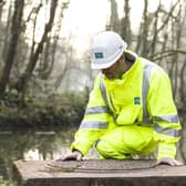 A Severn Trent worker making river checks EMN-210906-142628001