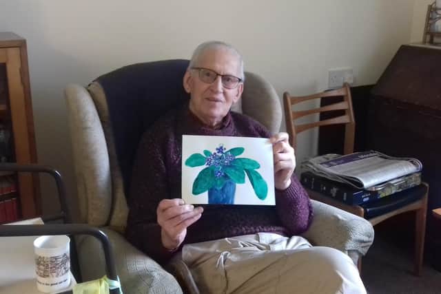 Leslie Posnett (100) with one of the paintings he submitted for a virtual lockdown time capsule EMN-210706-174042001