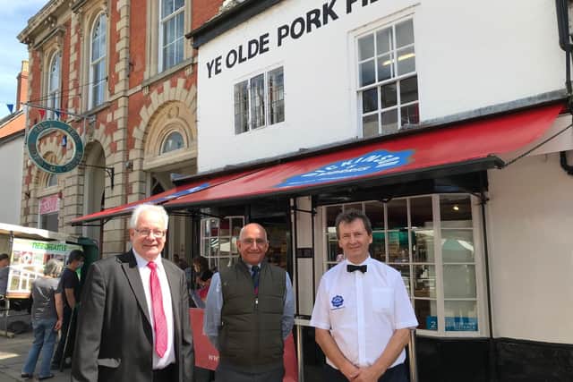 Lord-Lieutenant of Leicestershire, Mike Kapur (centre), visits Melton's Dickinson and Morris Ye Older Pork Pie Shoppe, with Matthew O'Callaghan (left) and Stephen Hallam EMN-210806-154152001