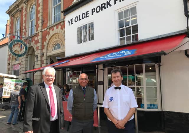 Lord-Lieutenant of Leicestershire, Mike Kapur (centre), visits Melton's Dickinson and Morris Ye Older Pork Pie Shoppe, with Matthew O'Callaghan (left) and Stephen Hallam EMN-210806-154152001