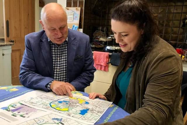 Melton Borough Council leader Joe Orson examines the route of the approved Melton Mowbray Distributor Road (MMDR) with Rutland and Melton MP, Alicia Kearns EMN-210615-130140001