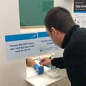 A rapid lateral flow test being taken for coronavirus at a Leicestershire  community site EMN-211106-123033001