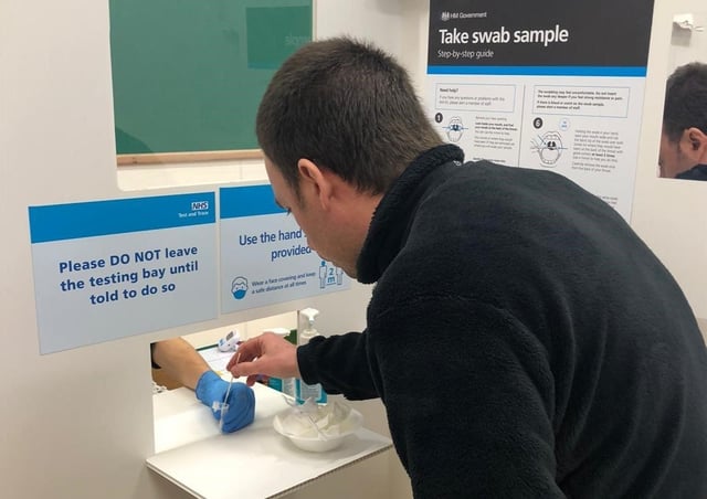 A rapid lateral flow test being taken for coronavirus at a Leicestershire community site EMN-211106-123033001
