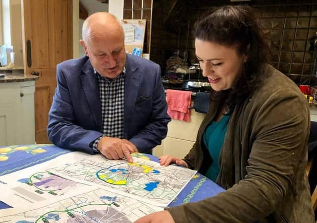 Melton Borough Council leader Joe Orson examines the route of the approved Melton Mowbray Distributor Road (MMDR) with Rutland and Melton MP, Alicia Kearns EMN-210615-130140001