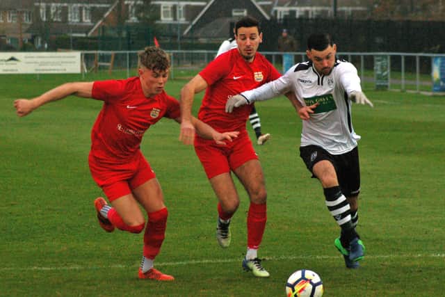 Melton Town FC's Tom Rigby and Jordan Lever chase back as Anstey put Town under pressure back in 2018 - the club wants to replace its grass pitch with a 3G surface EMN-210621-121429001