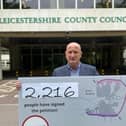 Melton Borough Council leader, Councillor Joe Orson, delivers a petition to County Hall calling on Leicestershire County Council to reconsider its intention to reject £15milllion in government funding towards a proposed southern link to Melton's approve partial bypass EMN-210621-124759001