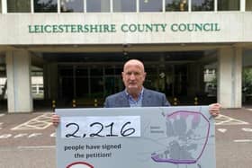 Melton Borough Council leader, Councillor Joe Orson, delivers a petition to County Hall calling on Leicestershire County Council to reconsider its intention to reject £15milllion in government funding towards a proposed southern link to Melton's approve partial bypass EMN-210621-124759001