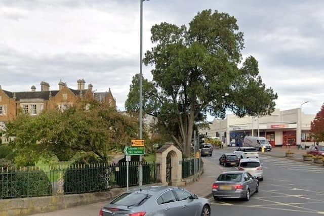 The historic archway at Melton's Memorial Gardens pictured before it was demolished in a road collision at the weekend EMN-210621-134110001