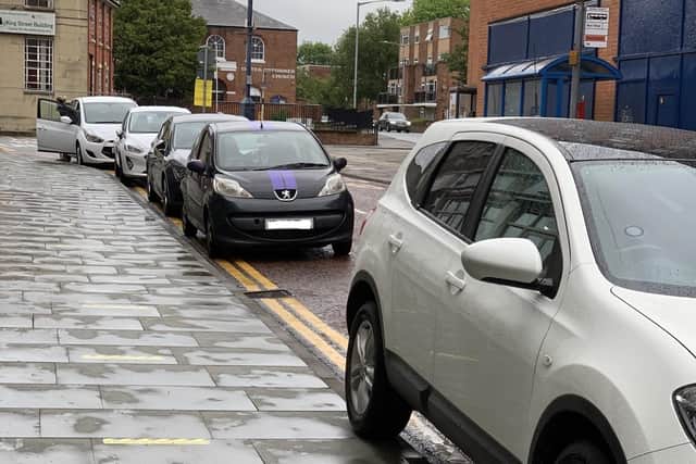 Cars parked on yellow lines in Windsor Street, Melton, on Friday evening EMN-210621-153009001